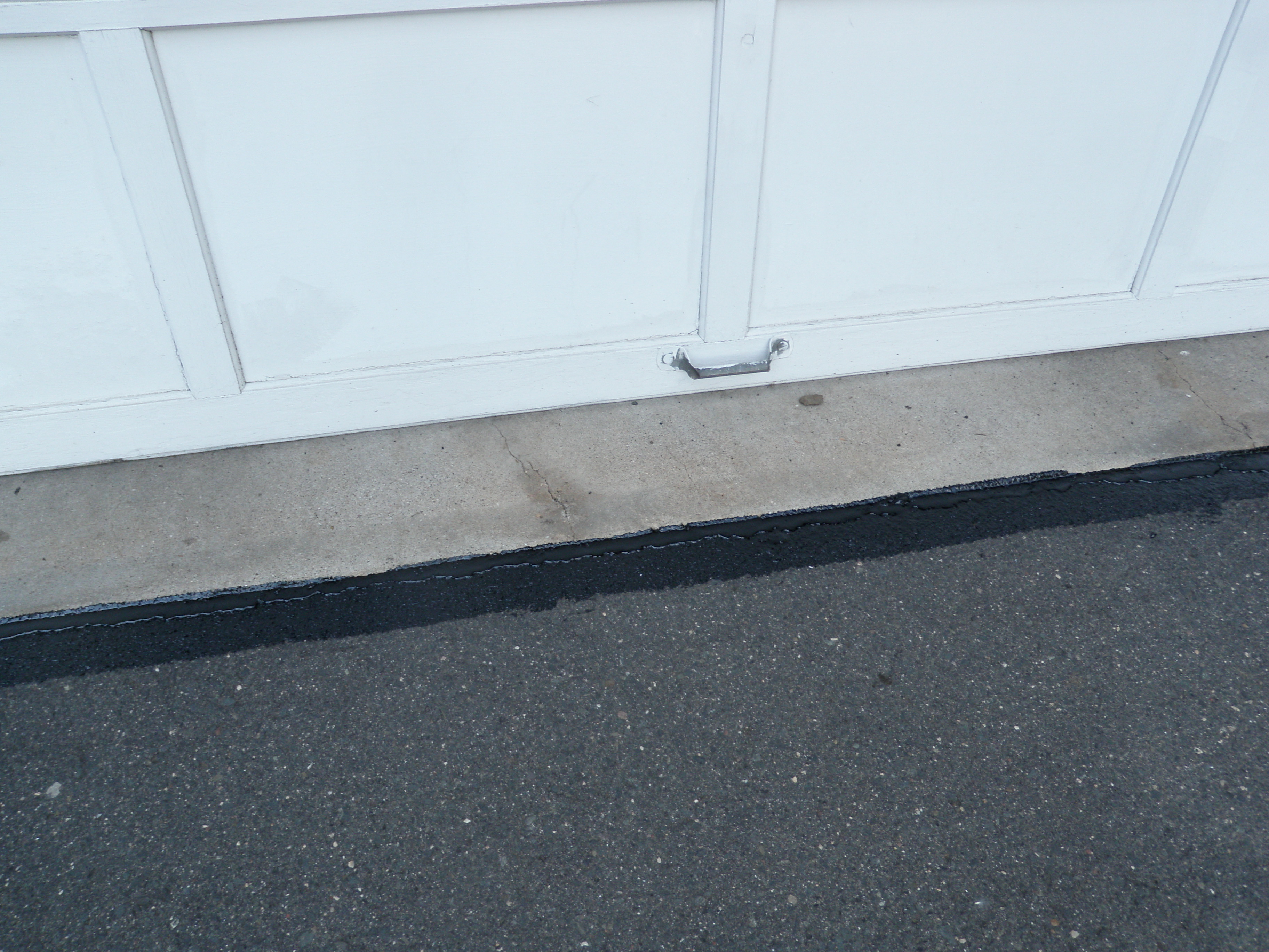 Sealant Between Garage and Driveway